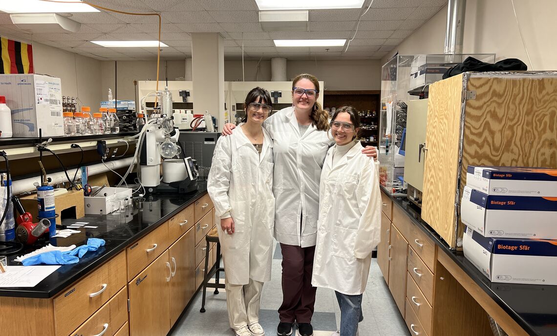 Lyla Naqvi '23, Professor Sarah Tasker, and Katie DeSimone '23 in the lab where the discovery happened.