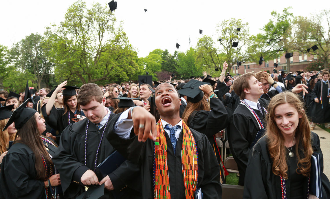 That's a wrap, folks. Giddy graduates toss their mortarboards skyward as Commencement comes to a close.
