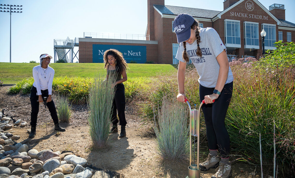 Students in Sybil Gotsch's ecohydrology lab collect data from rain gardens outside Shadek Stadium as part of a comprehensive study.
