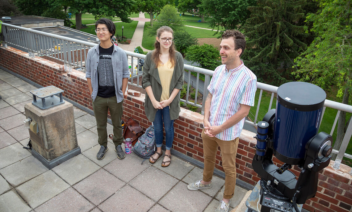 Assistant Professor of Physics Ryan Trainor, right, with rising seniors Issac Lin and Becca McClain, who are performing data analysis on galactic activities from other telescopes and preparing for the JWST data that future F&M students will research.