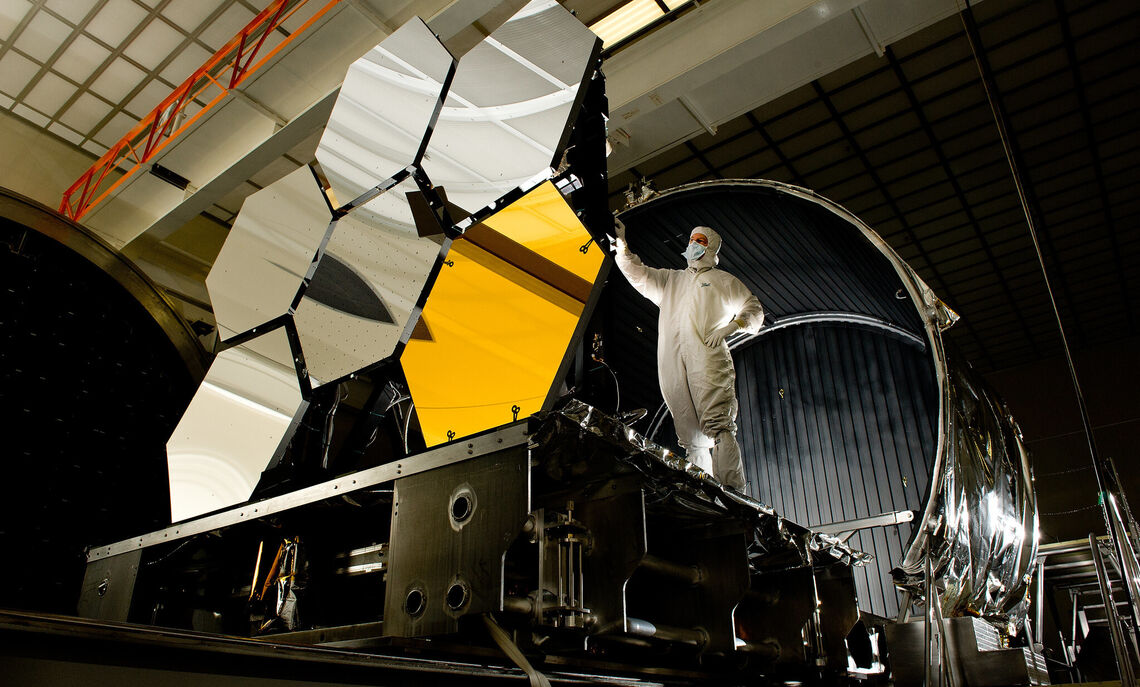 NASA engineers at work on the space telescope's mirror assembly.