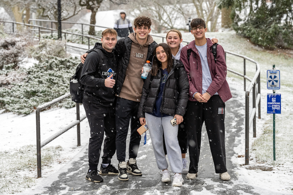 Students in snow on campus