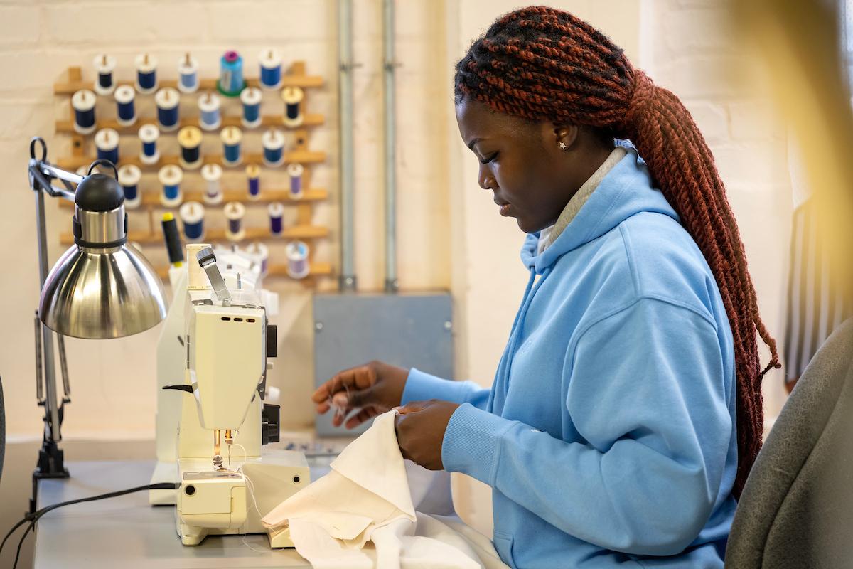 In her role, Osei assists with costume preparation for theater productions.