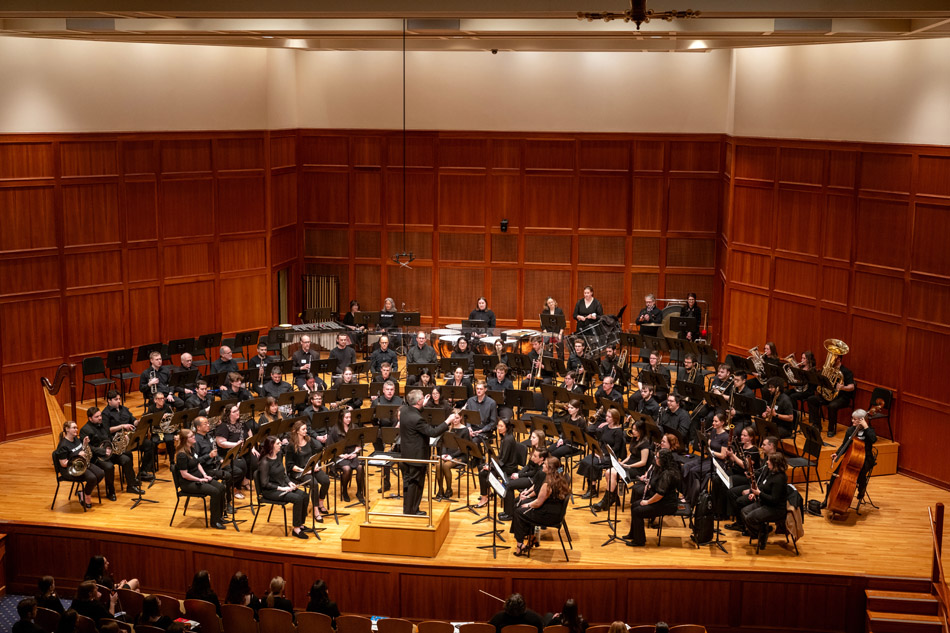 Brian Norcross leads the alumni orchestra
