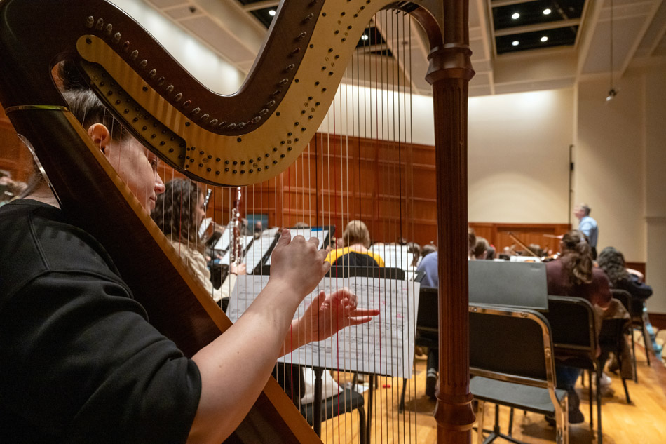 Brian Norcross leads the alumni orchestra
