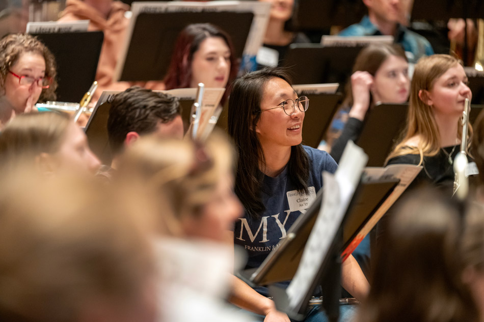 Brian Norcross leads the alumni orchestra rehearsal