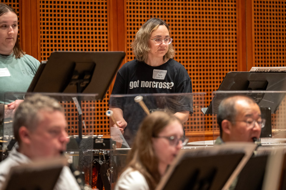Brian Norcross leads the alumni orchestra rehearsal
