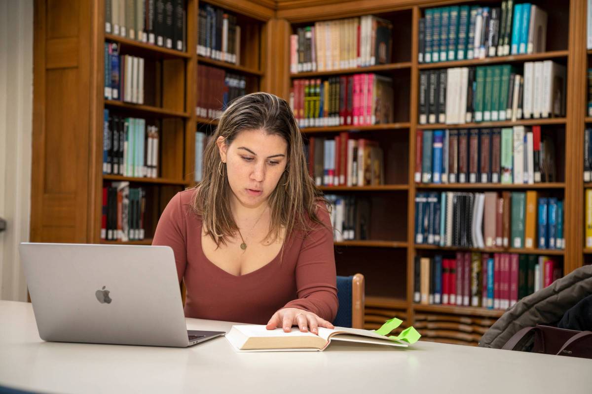 Anna Synakh studying in the library