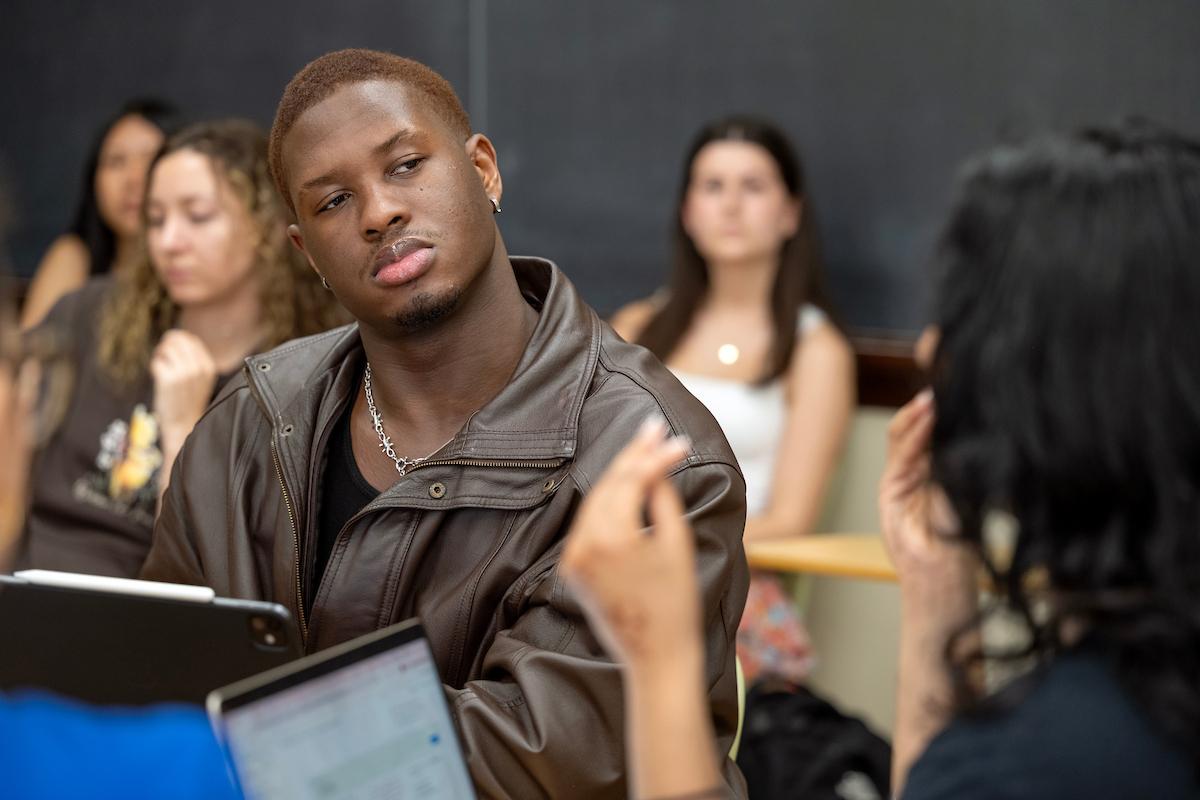 Students discuss the sociological impacts of AI in class