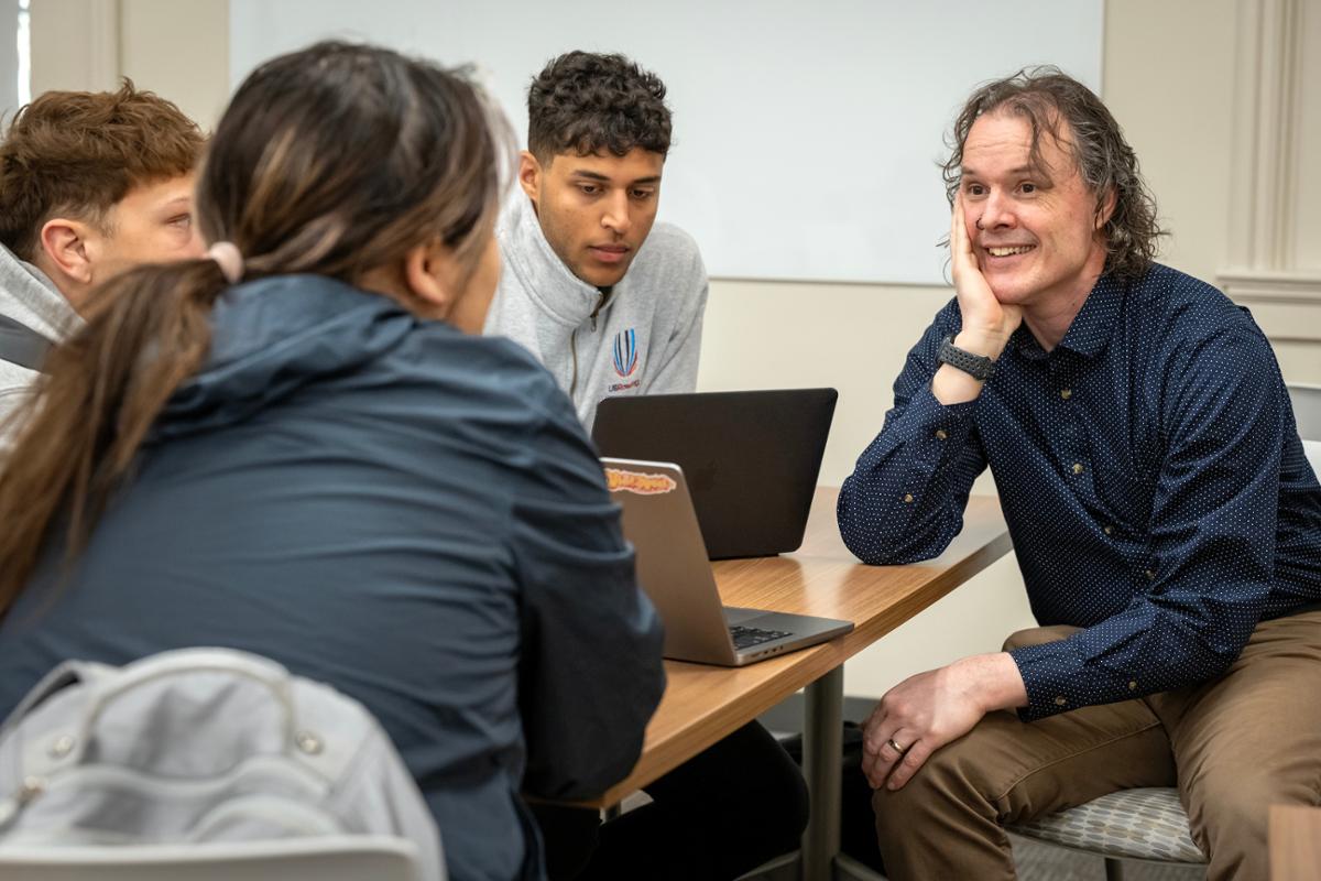 Jason "Willie" Wilson, assistant professor of computer science, with students in his Machine Ethics course.