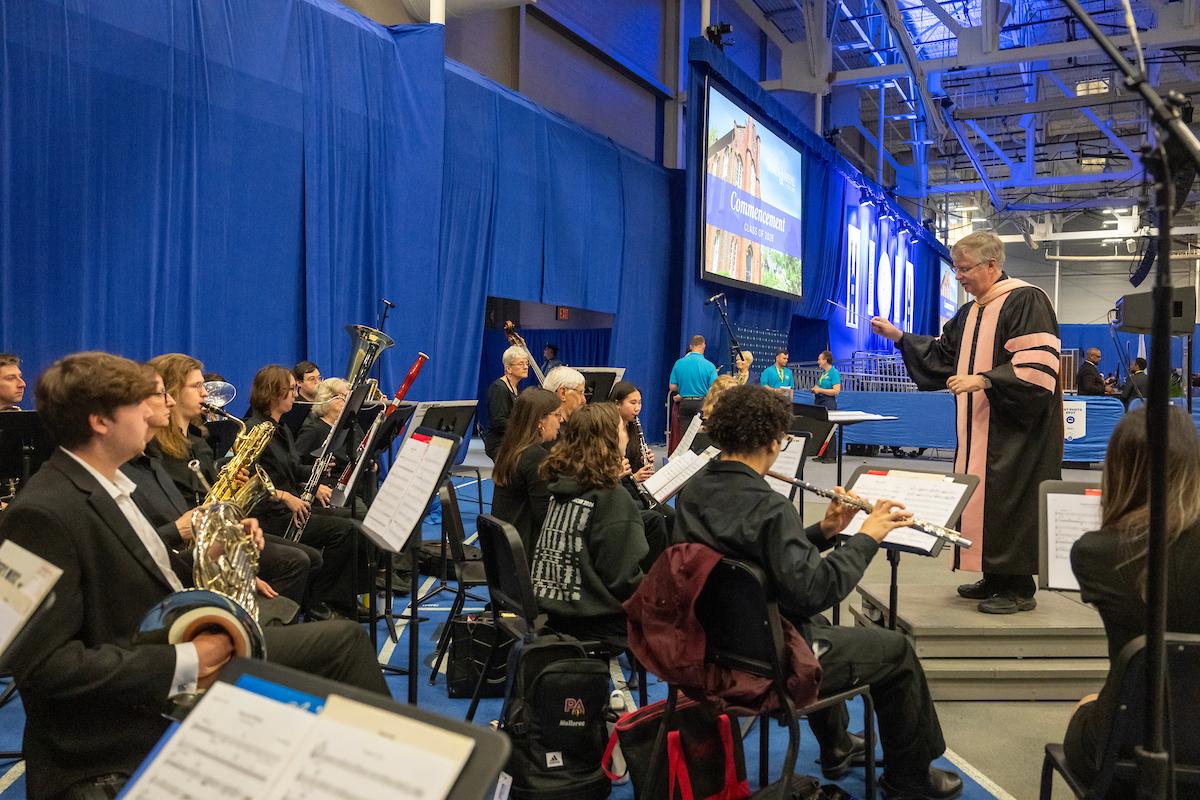 Brian Norcross conducts the wind ensemble at F&M Class of 2026 Commencement