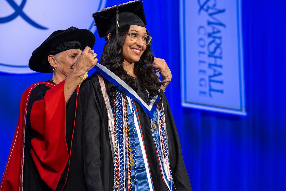 President Barbara K. presents Shayra Nunez '25 with the Williamson Medal.