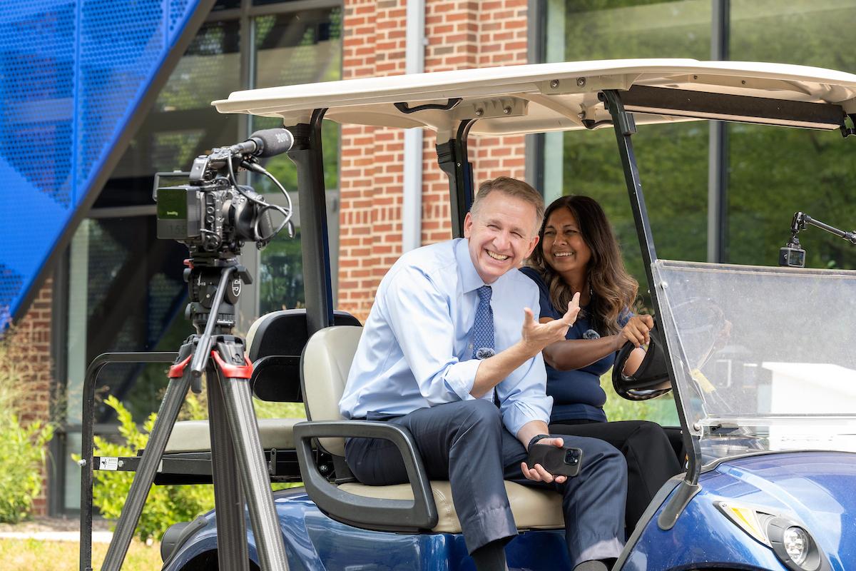 Behind the scenes filming of a True Blue Weekend video with President Andrew "Andy" Rich and Provost Sunita Kramer.