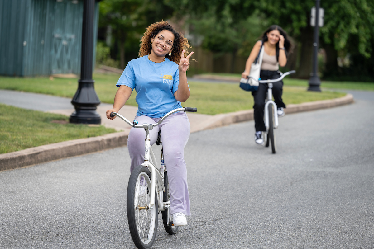 Student biking on campus