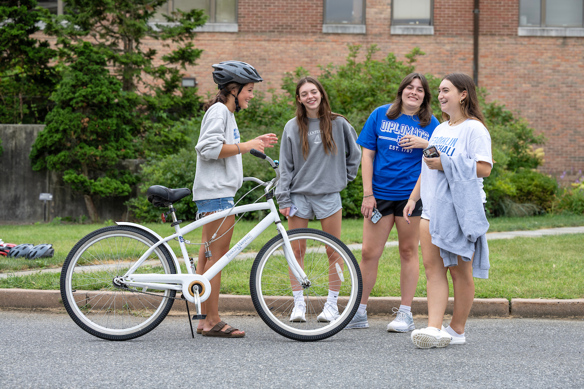 Student biking on campus