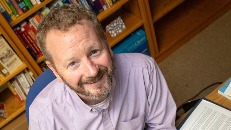 Professor Greg Kalisz in his campus office.