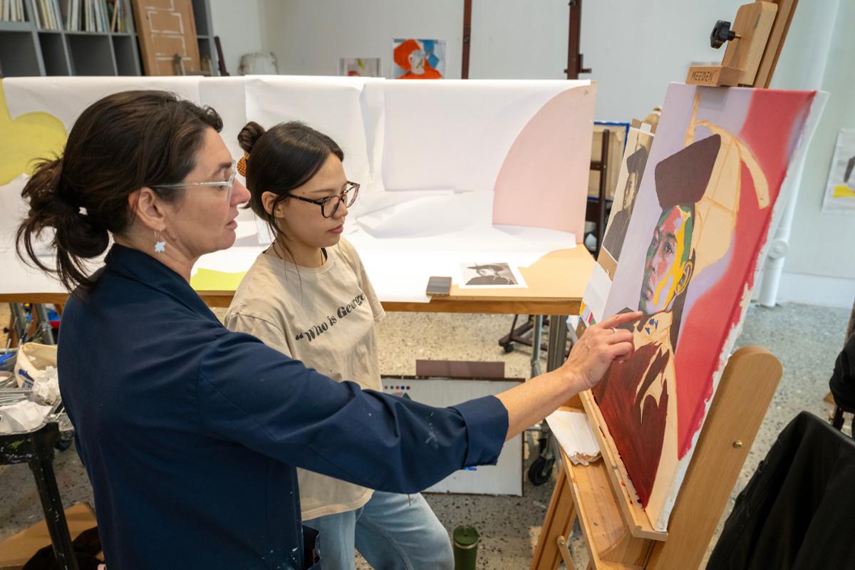 Associate Professor of Visual Arts Magnolia Laurie (left) advises a student in F&M's Winter Visual Arts Center.