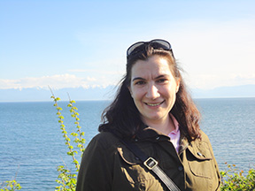A photo of Elizabeth De Santo in front of the ocean. 