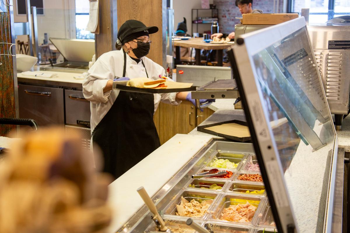 Penny McMorrow prepares sandwiches.