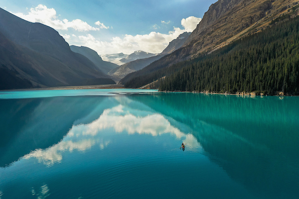 An alpine lake reflecting the sky.