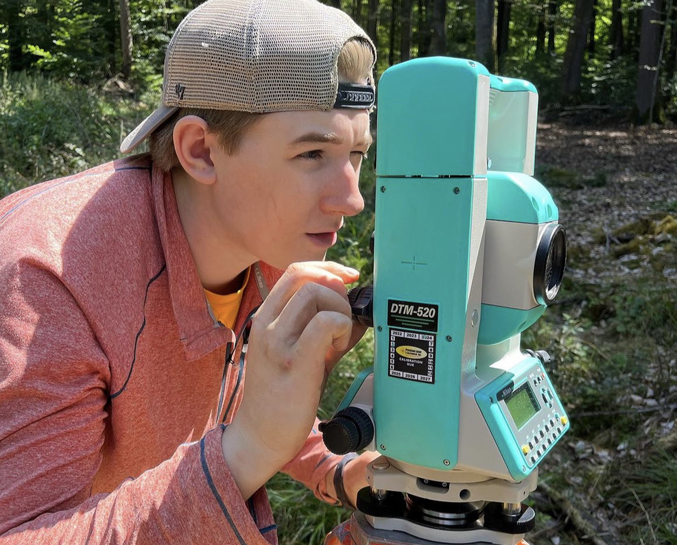 Senior Gavin Vogel surveying the crash site in the Black Forest.