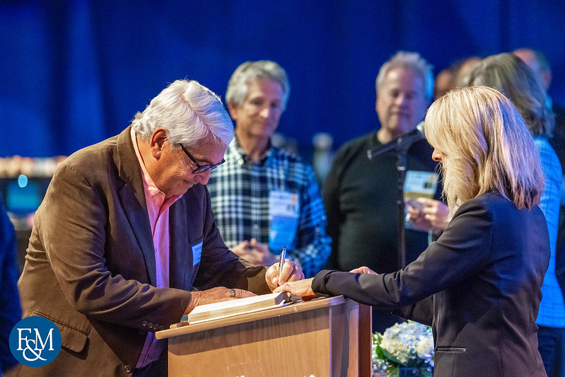 New inductees sign Prexy's Book.