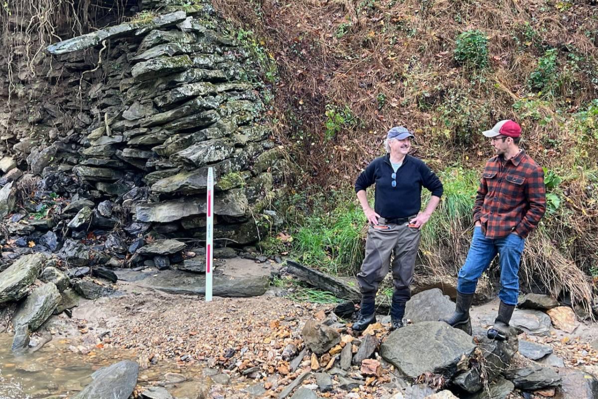 Professors Bob Walter and Patrick Fleming at the site of a dam collapse in Lancaster County.
