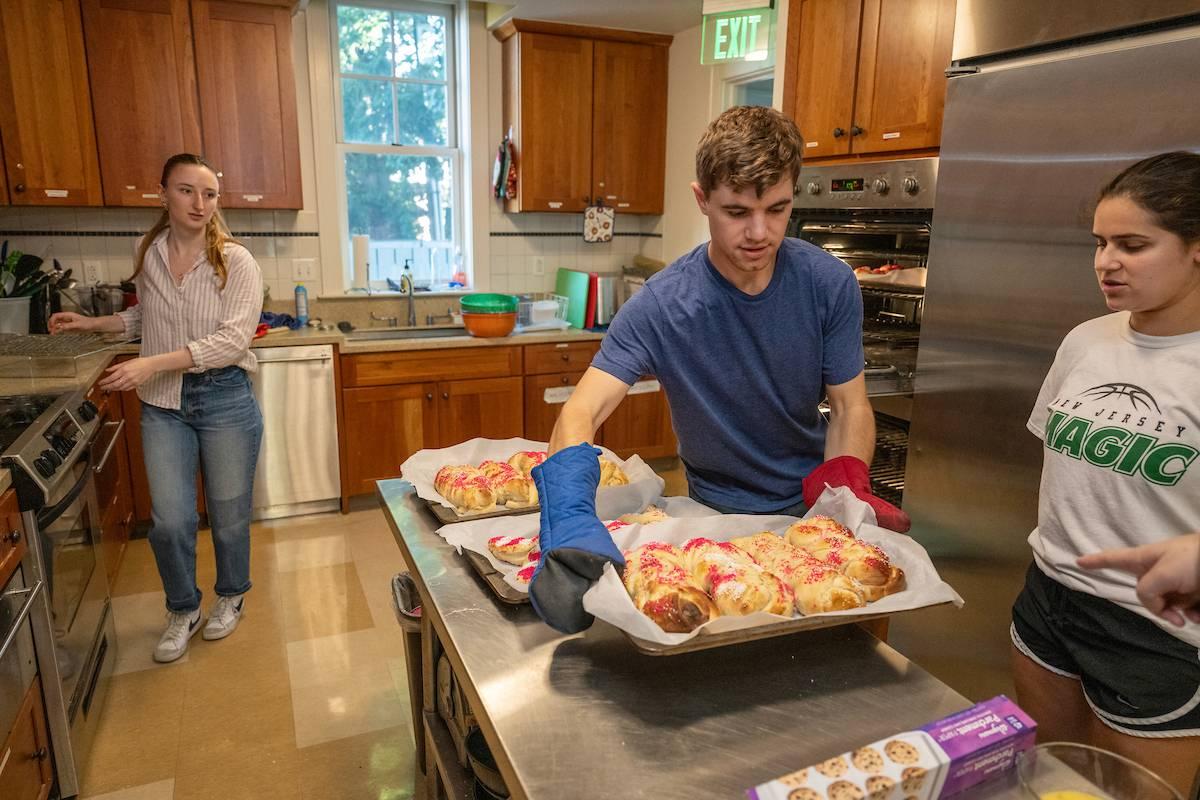 Students braid and bake challah at "Pink Shabbat," an annual fall breast cancer fundraiser at the Klehr Center for Jewish Life.