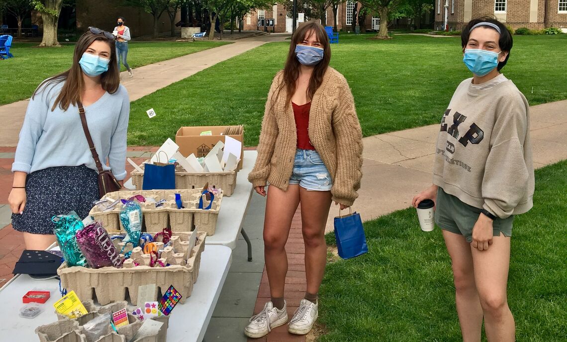 Peer health educators Sarah Laterza '21, Caroline Tippett '21, and Hala Reeder '22 oversee a campus de-stress event on Hartman Green.