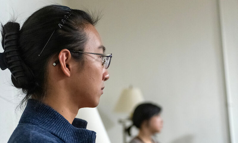 William Li '23 enjoys tea and conversation after a meditation session in Ware College House den.