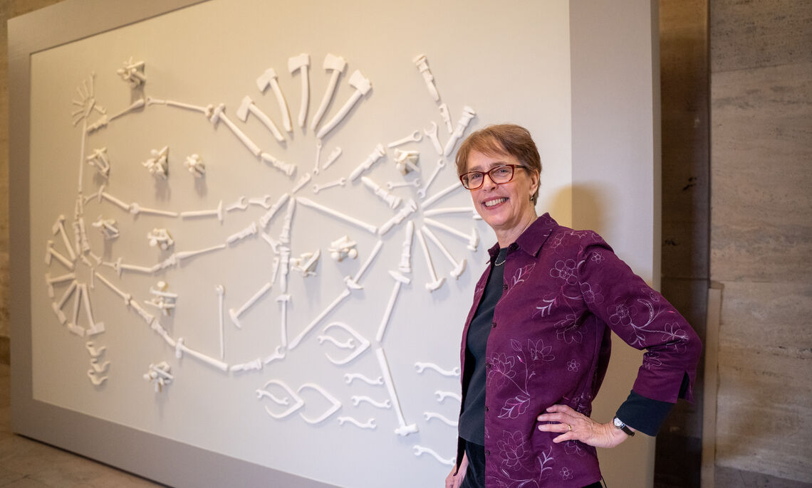 Virginia Maksymowicz and "Tools of the Trade," her sculpture of Amtrak's national rail network that now hangs in Philadelphia's 30th Street station. The station was renamed a few years ago for the late F&M graduate William H. Gray '63.