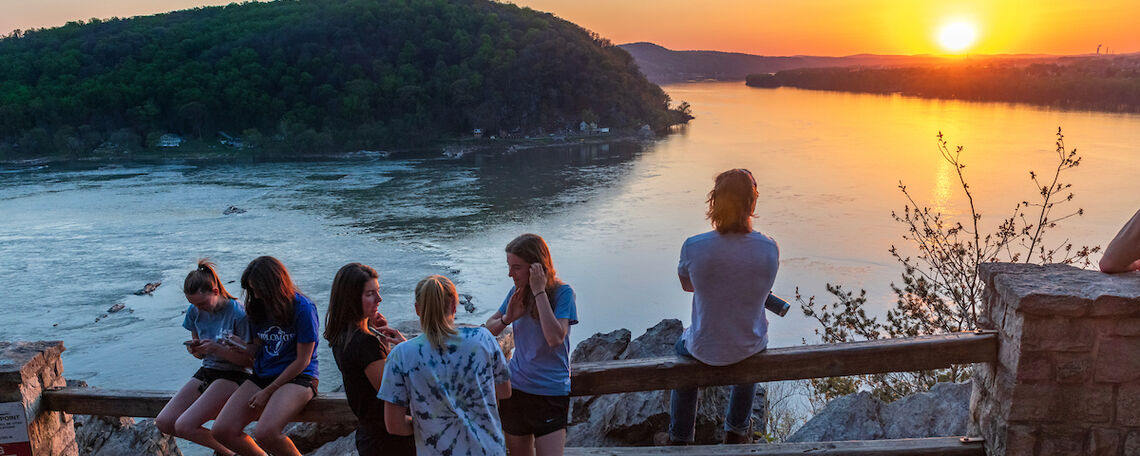 Students spend time catching up with friends at the Chickies Rock overlook.