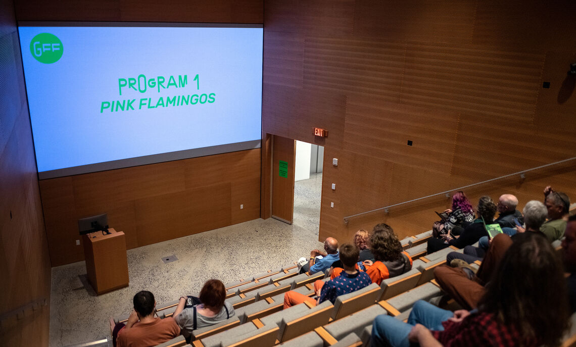 People arrive in the Laiks Cinema for the screening of Pink Flamingos, the opening show of Gleaners Film Festival.