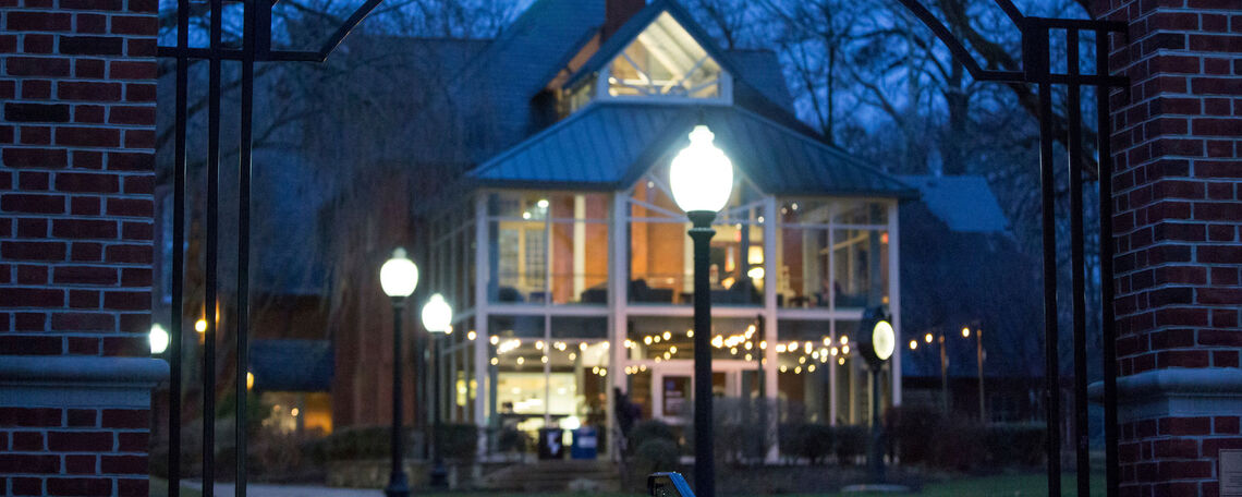 Students gather in the warm glow of Blue Line cafe during an evening in early March.
