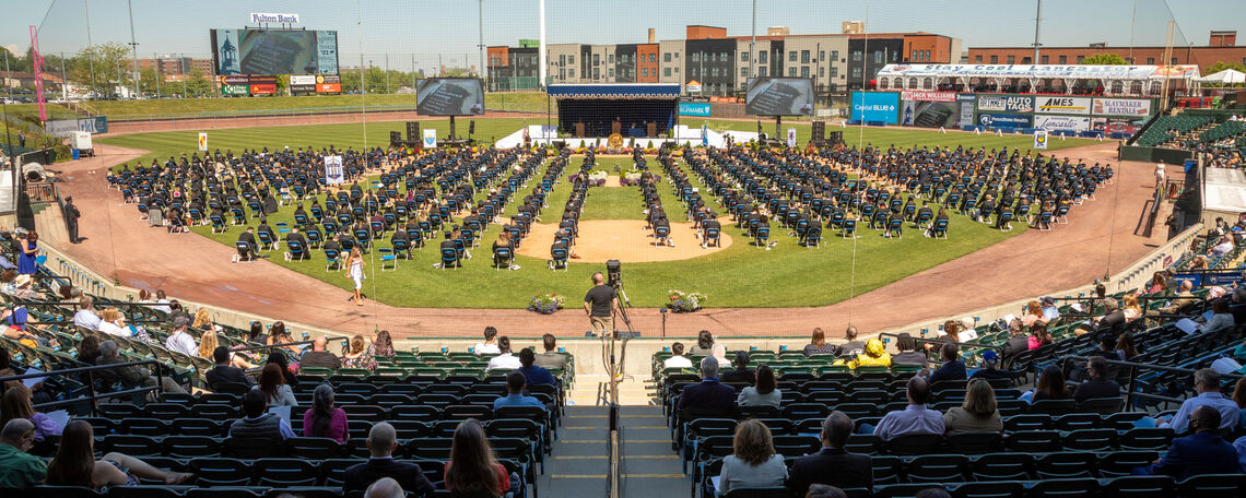 Members of the Class of 2021 – with family and friends watching from Lancaster Clipper Stadium seats – wait to receive their diplomas during F&M Commencement held May 15.