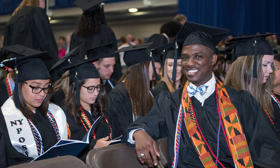 Graduating senior Donnell Bailey strikes a relaxed pose in the minutes running up to the beginning of Saturday's Commencement ceremony.