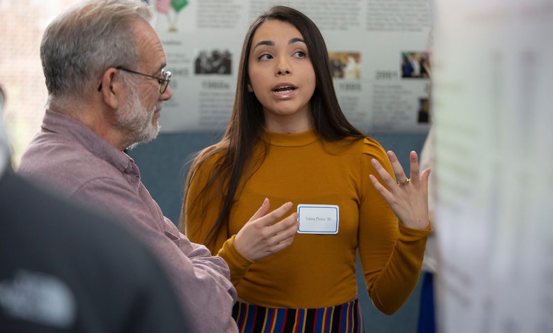 At the Autumn Research Fair Friday afternoon, junior Taina Perez discusses one of her two projects: 