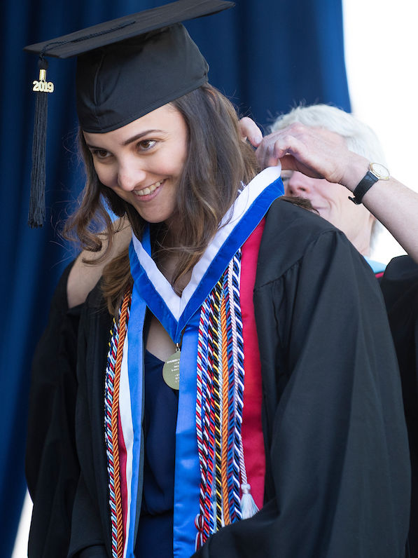 Vice President and Dean of Student Affairs Margaret Hazlett presents the Williamson Medal to Yousura Chaabane '19.