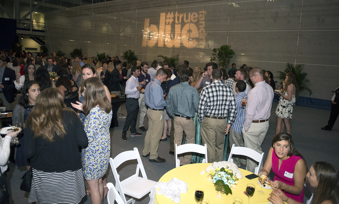 Members of the Class of 2017 gather for the Senior Toast May 11 in the Alumni Sports & Fitness Center. During the event, the class presented its gift to the College, a check for more than $4,500. Nearly three-quarters of the seniors made a gift.