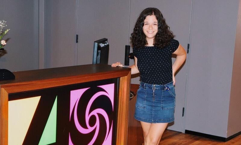 Elena Robustelli ’21 poses by the sign for Atlantic Records, a recording label she interned with.