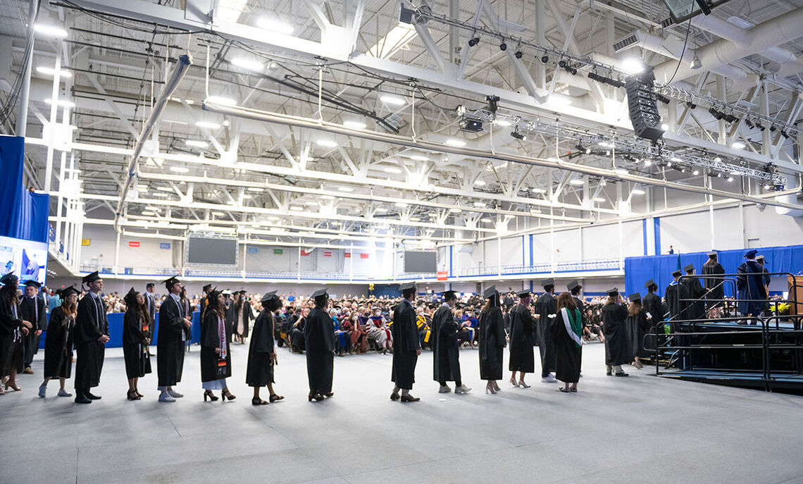 Soon-to-be graduates line up to walk the stage at Commencement and receive their well-earned diplomas.