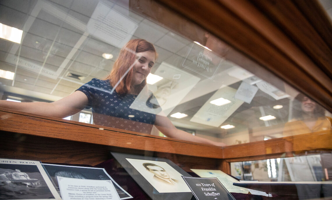 Reviewing a display case in Martin Library.