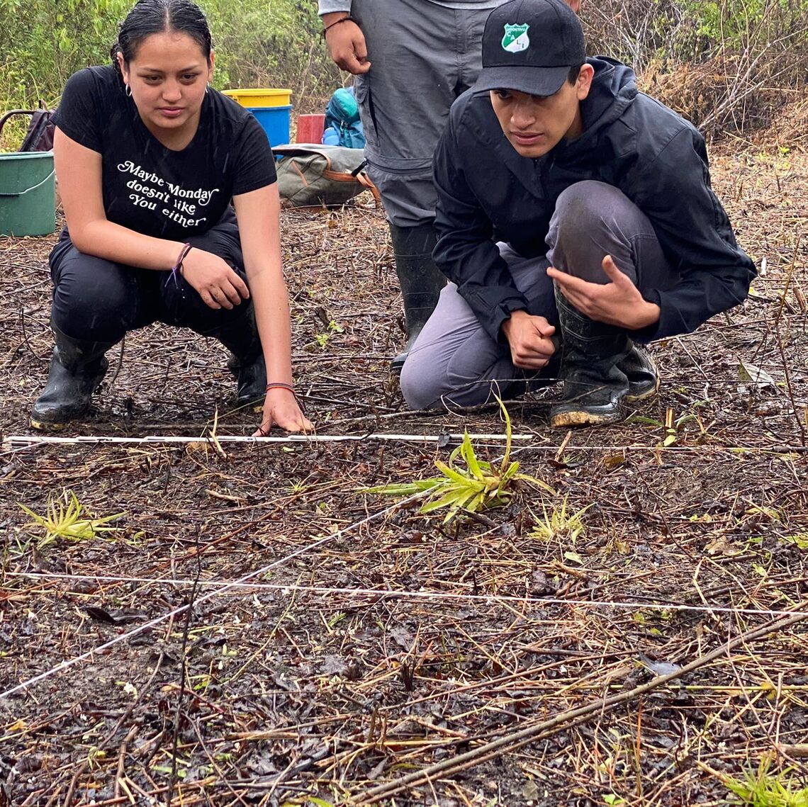 Rojas (on the right) working in the field