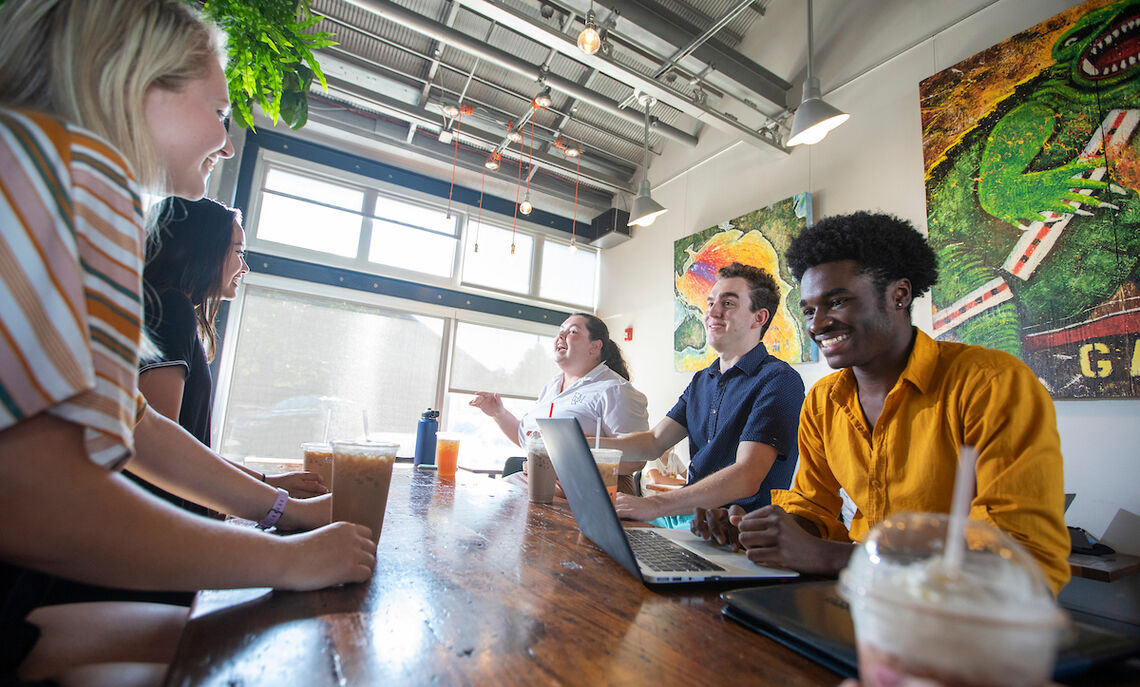 Students enjoy coffee and studying at Mean Cup