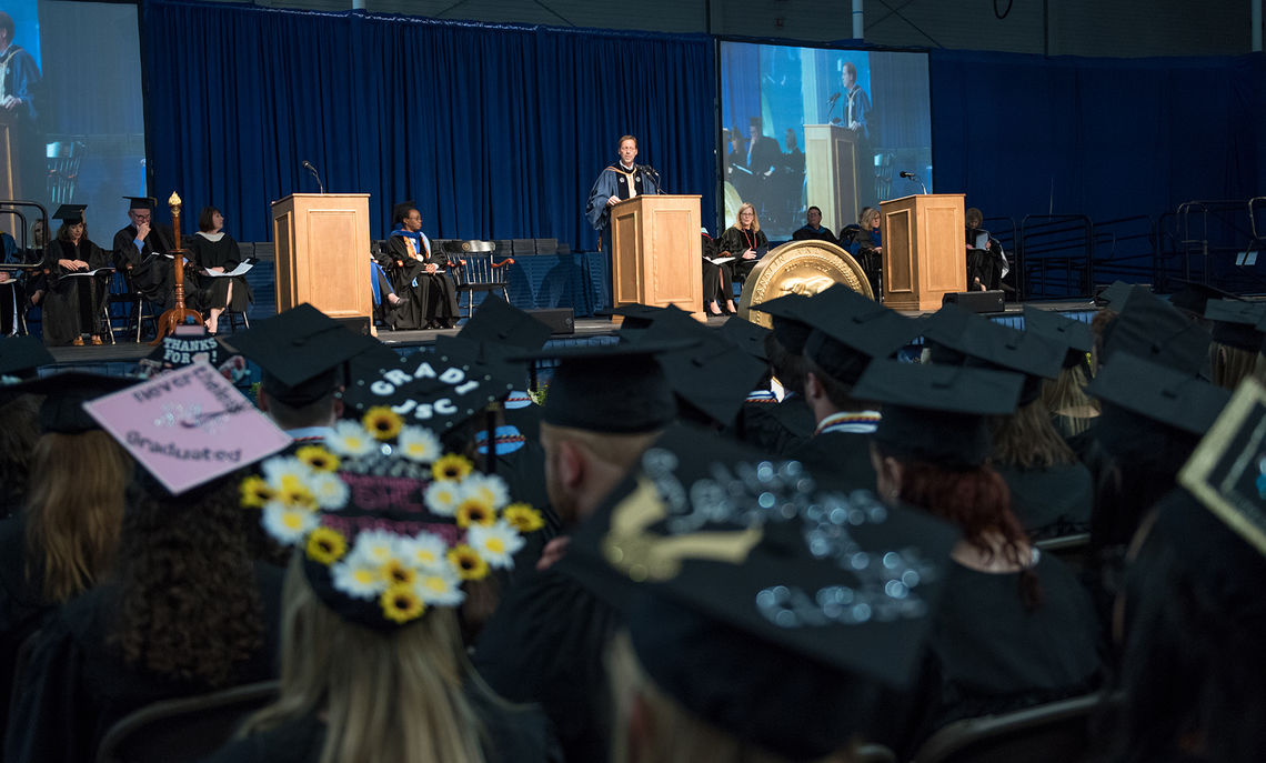 Franklin & Marshall College President Daniel R. Porterfield and the platform party look out upon a sea of new graduates during the May 13 Commencement ceremony at F&M.