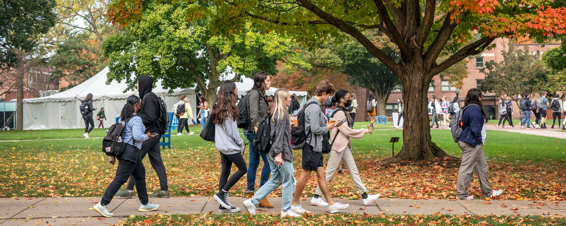 Students walk to class on F&M campus in the fall