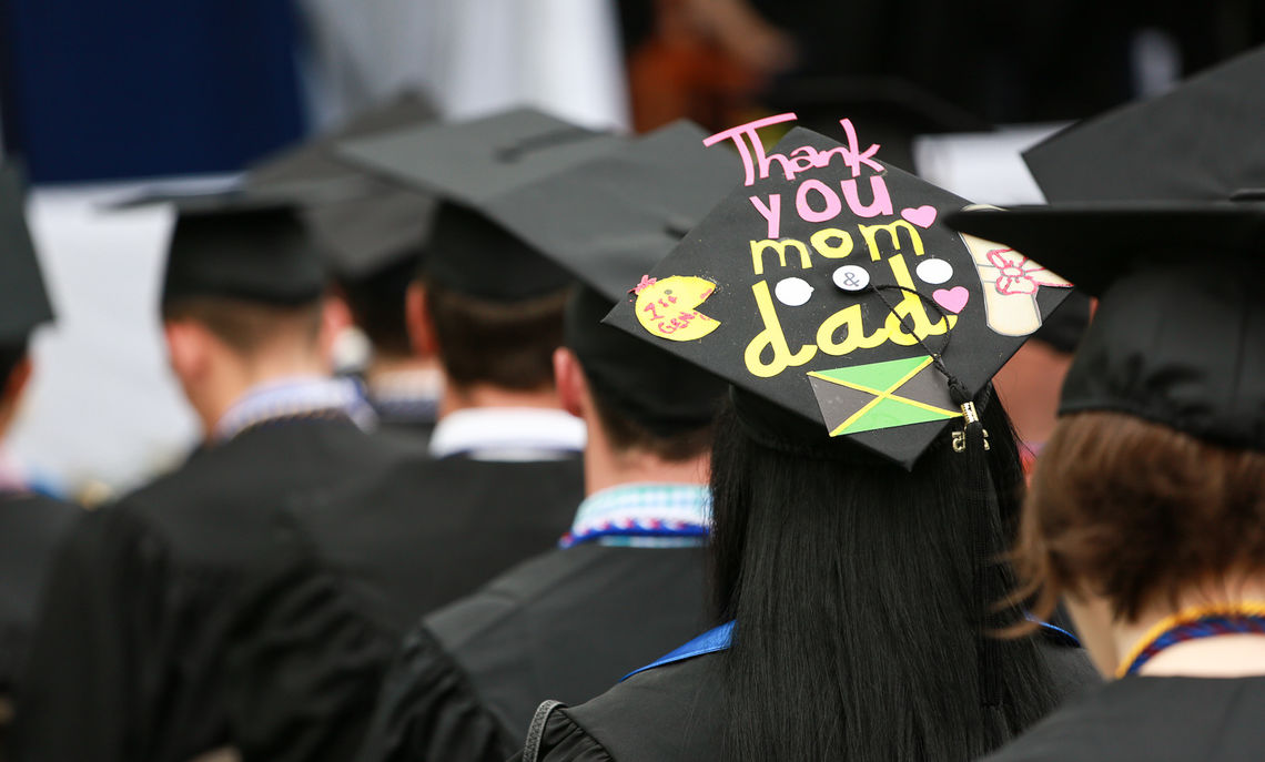 Many members of the Class of 2015, including this one, use their mortarboard to display messages of thanks to family and friends.