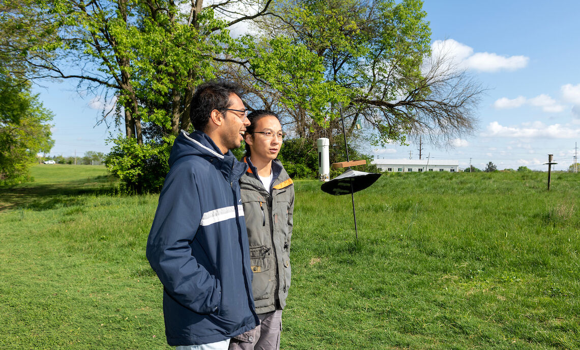 Vyas Agarwal '23 (left) and William Li  '23 discuss their field research at Baker Campus.