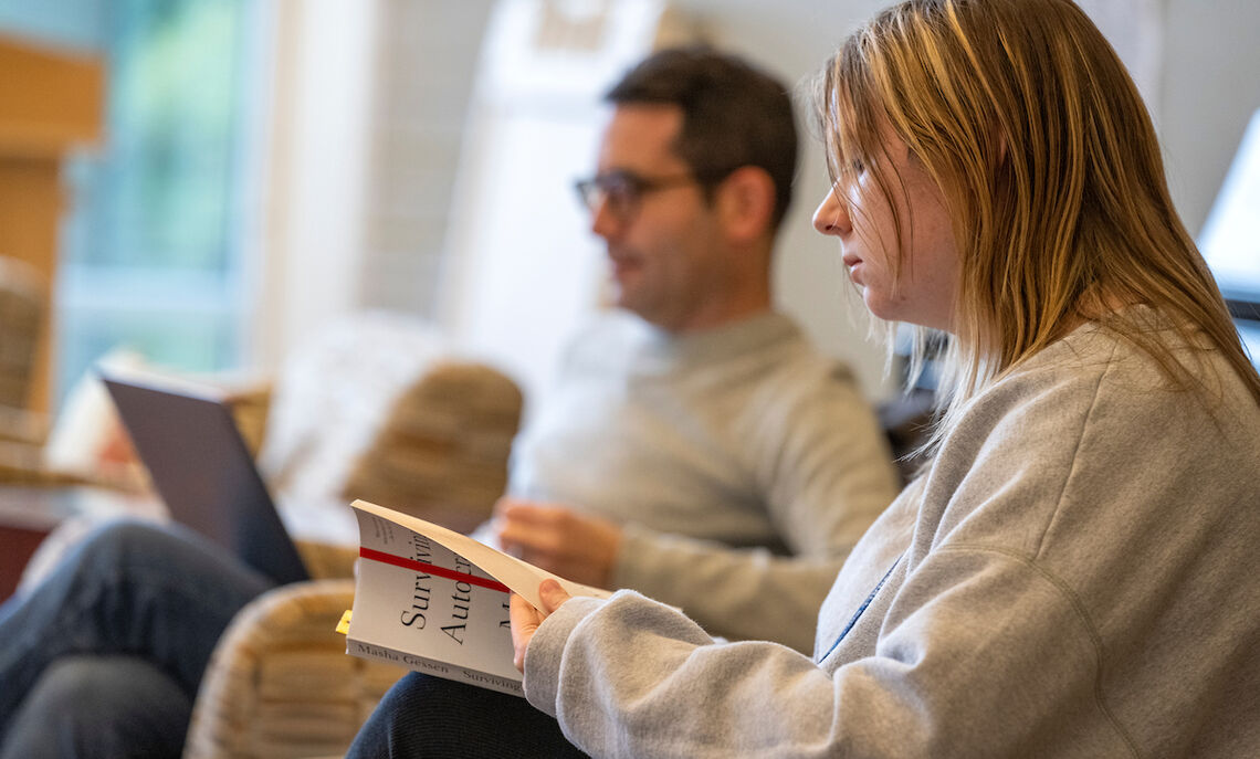 Russian Professor Jon Stone leads a discussion on journalist Masha Gessen's works on authoritarianism as first year Madison Galczyk turns to a particular passage.