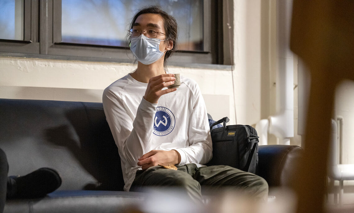 Nicolas Lin '24 enjoys tea after a weekly meditation session for students.